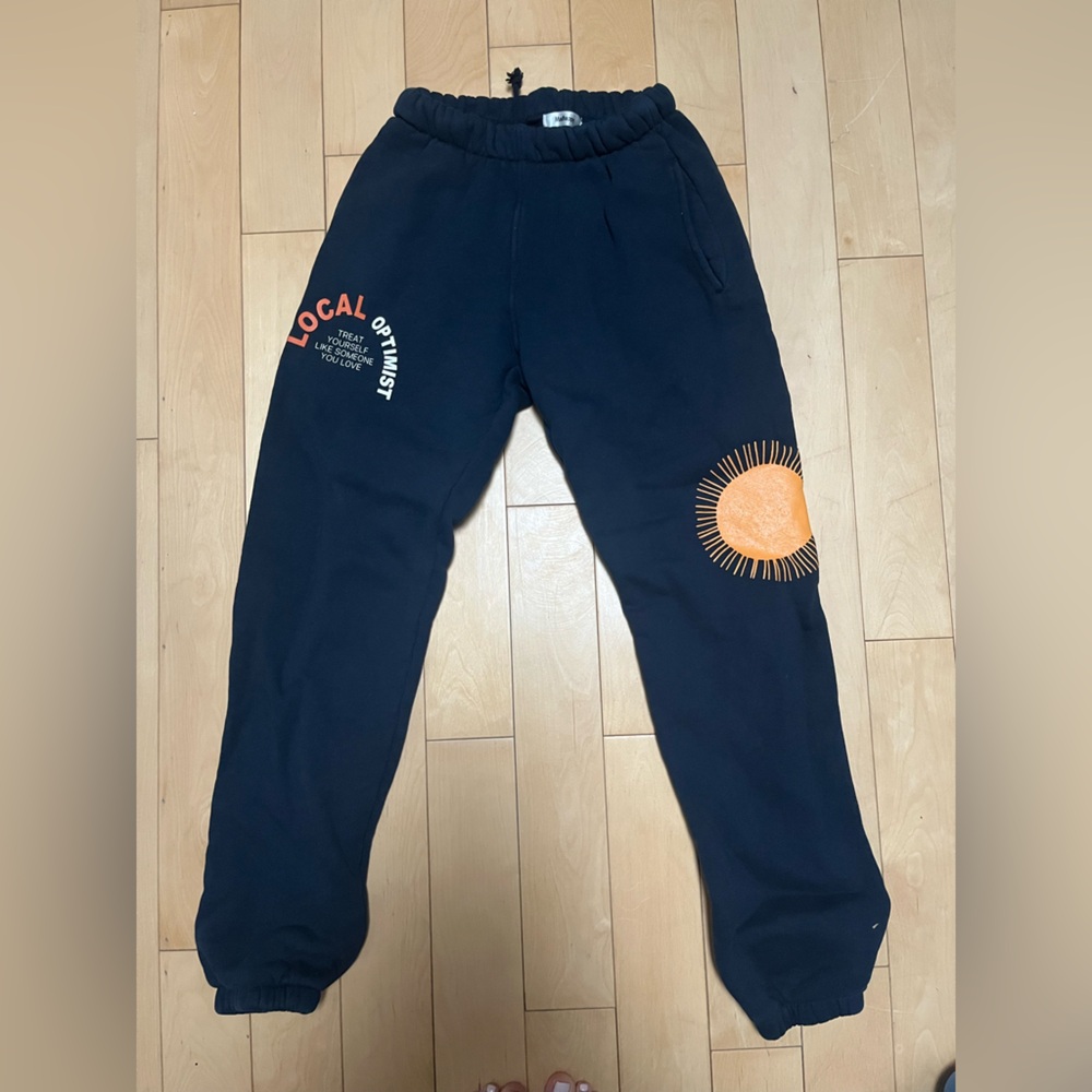 Madhappy Navy Sweatpants with Orange Sun Design